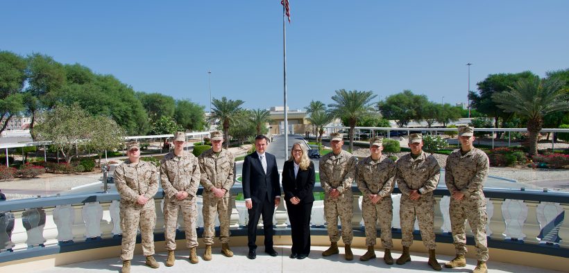 Jessica Moore with U.S. soldiers in Doha, Qatar