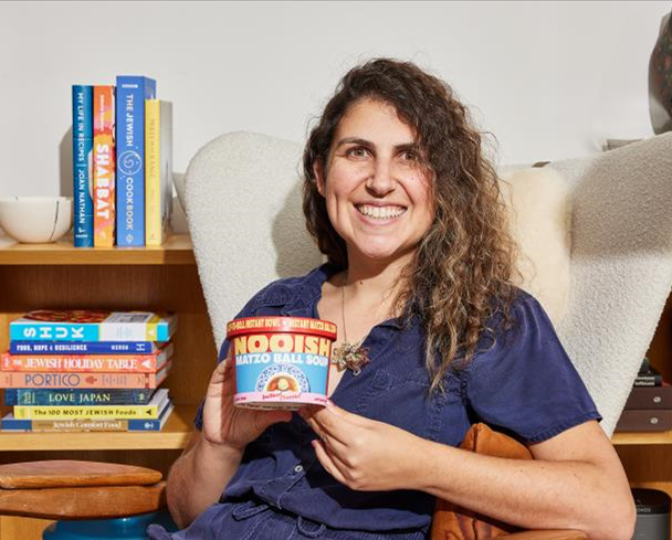 Sarah Nathan with a cup of Nooish soup