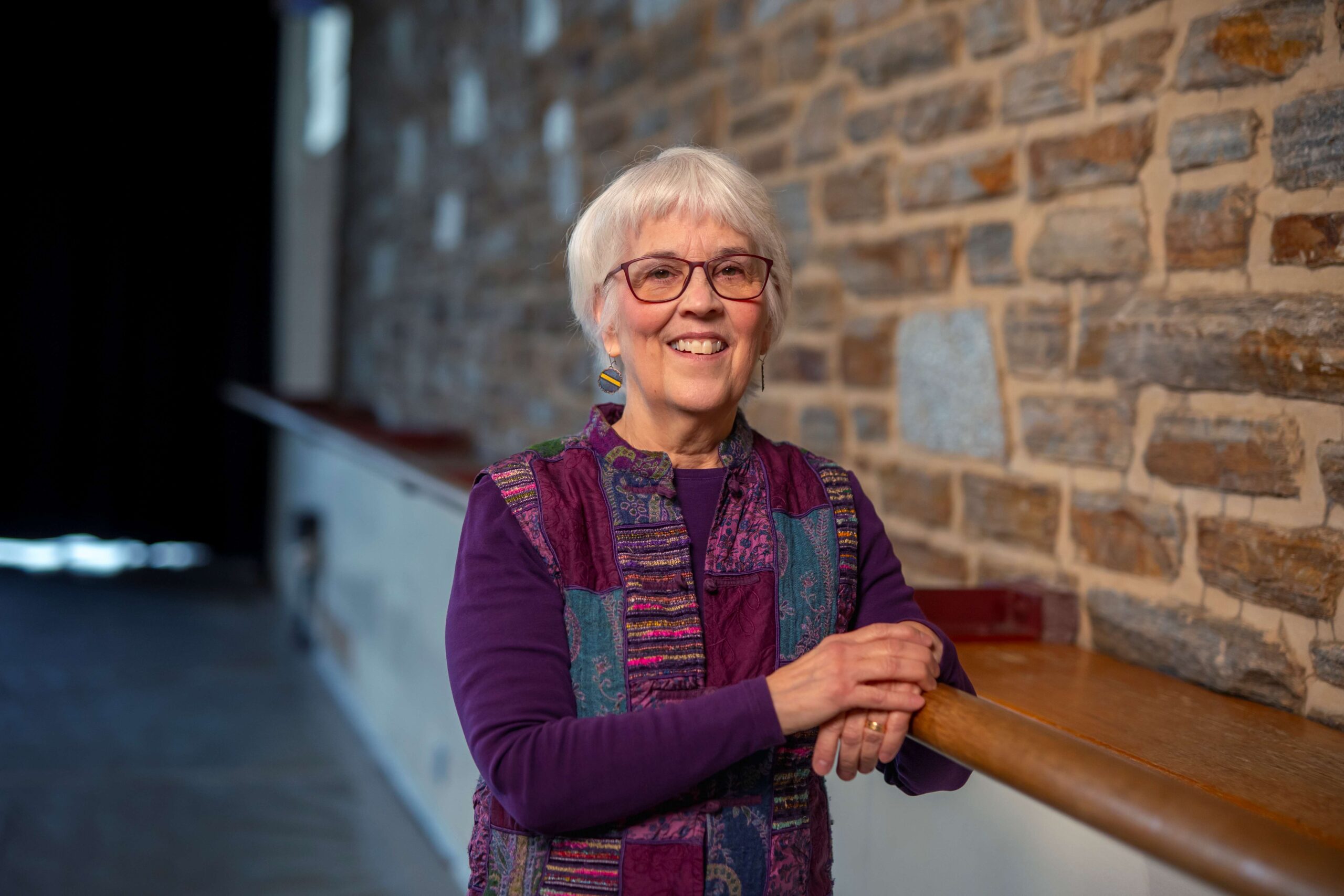 Sara Thomson leans against ballet barre