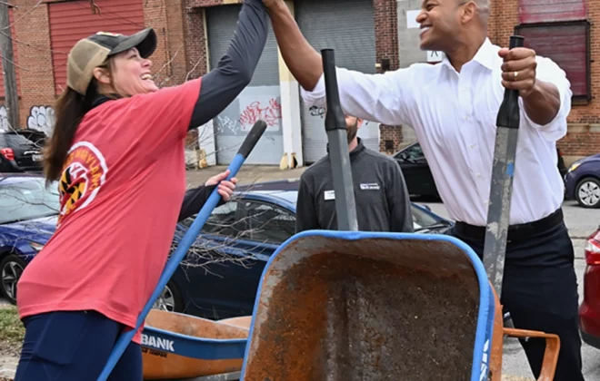 Two People High Fiving Community Service
