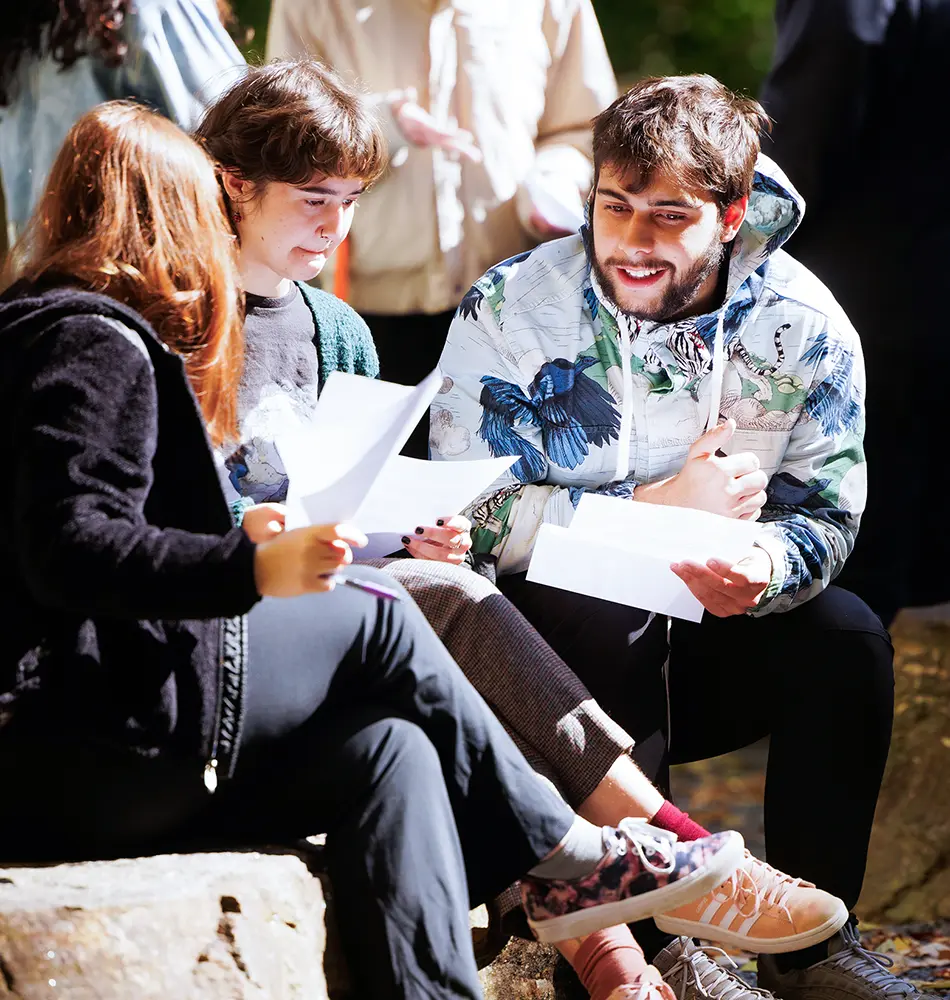 Students outside reviewing papers